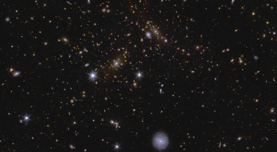 Various huge galaxy clusters as well as intra-cluster light, and gravitational lenses are visible in this image of an area of Euclid’s Deep Field South. The cluster near the centre is called J041110.98-481939.3, and is located almost 6 billion light-years away. Credits: ESA/Euclid/Euclid Consortium/NASA, image processing by J.-C. Cuillandre, E. Bertin, G. Anselmi.