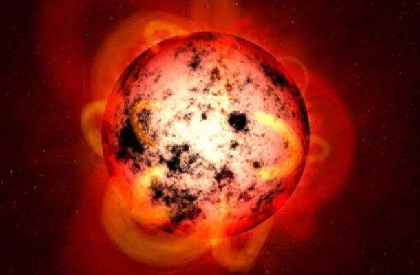 Il·lustració d'una estrella nana M coberta de taques estel·lars. Versió retallada de la imatge de NASA/ESA/STScI/G. Bacon.