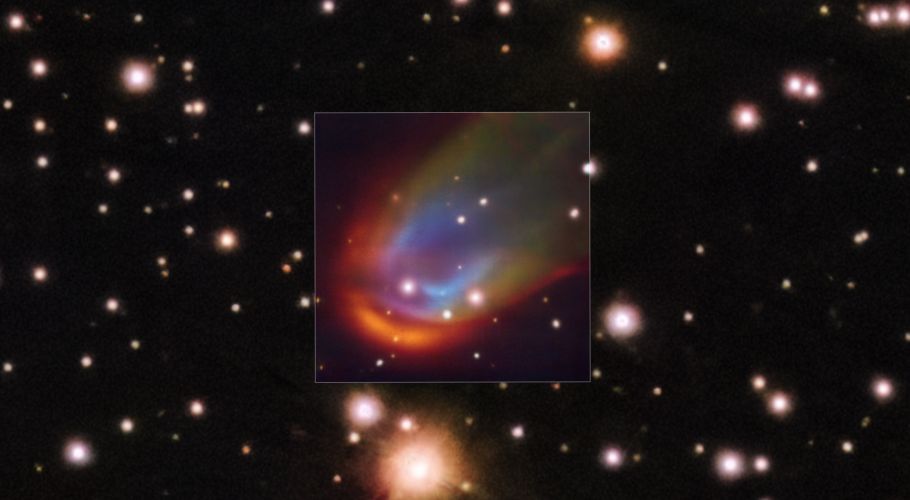 VLT image of a dead star creating a shock wave as it moves through space. Credits: ESO/K. Ilkiewicz and S. Scaringi et al. Background: PanSTARRS.