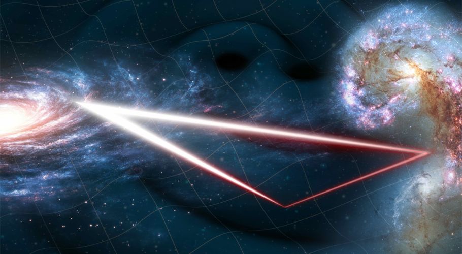 The image features thick red-to-white lines suggestive of light beams tracing a triangle in space. The three tips of the triangle point to the left, right and lower-centre parts of the image. On the left is a bright white-to-pink spiral-shaped swirl, dotted with white points and representing a galaxy. On the right, two bright white swirls (galaxies) are connected by brown filaments, dotted with orange-to-white spots. The dark blue background is overlaid with grey undulating grid-lines that trace waves in space, like waves in the sea. Credits: ESA.